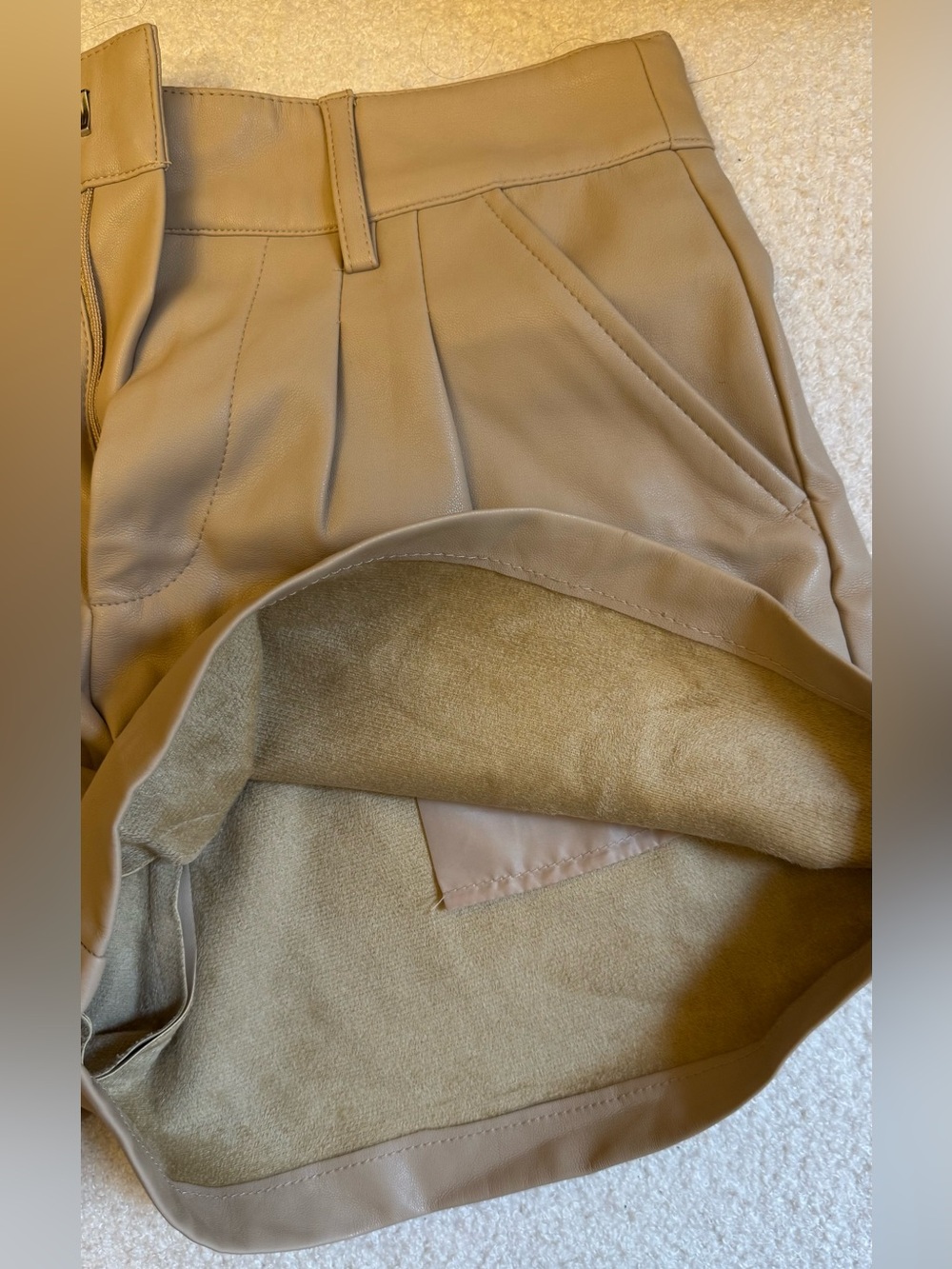 Never worn! Charlotte Russe Women's beige faux leather Shorts with pockets